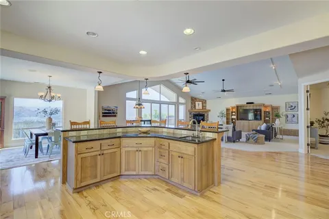 a kitchen with lots of counter top space and dining table