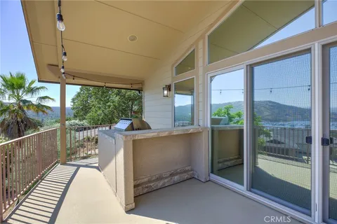 a view of a balcony with chairs