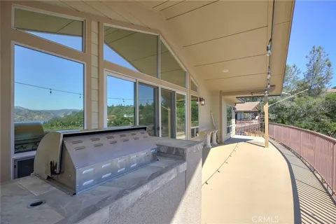 a view of balcony with couch and wooden floor