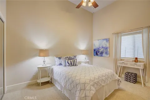 a view of a livingroom with furniture and a ceiling fan