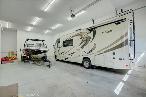 a view of a house with a yard and potted plants