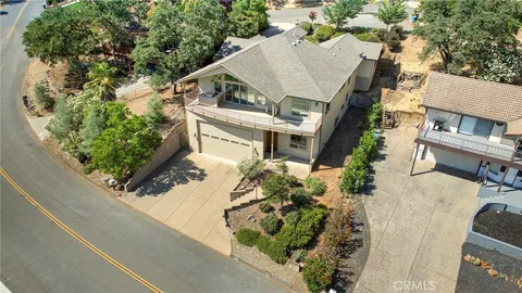 an aerial view of house with mountain view