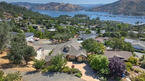 an aerial view of residential house and sandy dunes