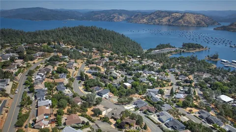an aerial view of waterside residential house with outdoor space