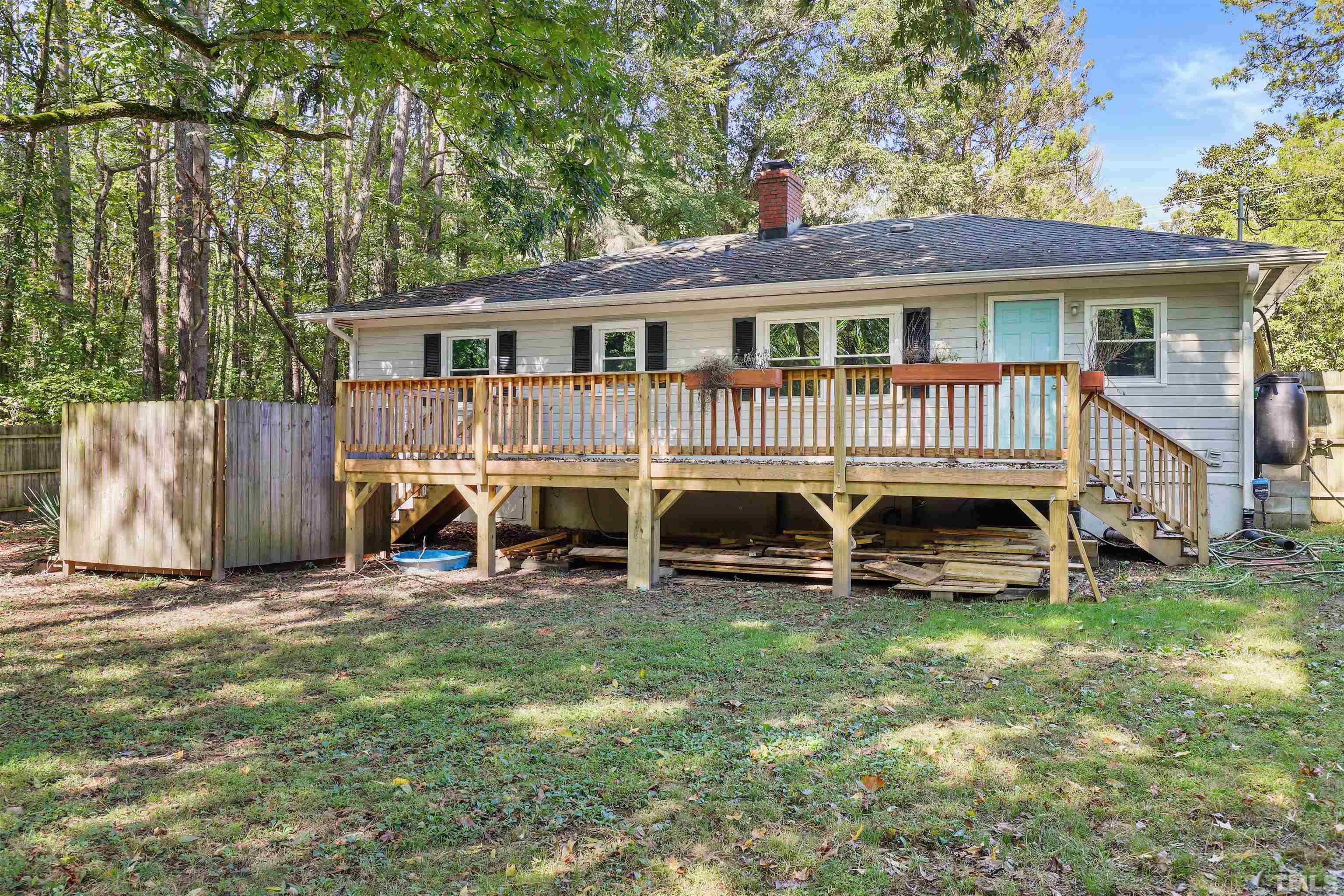 2706 Dearborn Drive Durham, NC 27704 - Photo 17 of 24 a view of a house with a yard and sitting area