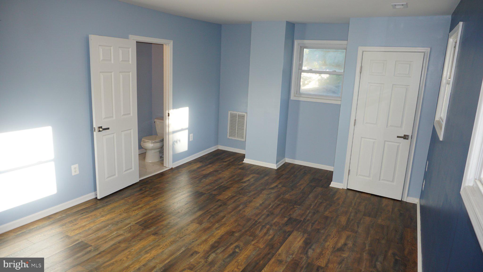 5854 Deale Churchton Road Deale, MD 20751 - Photo 47 of 57 Bright and airy room with blue walls.