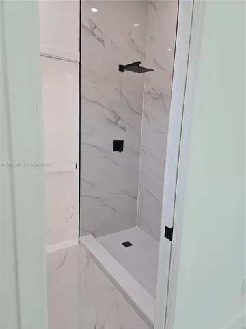 a kitchen with stainless steel appliances granite countertop a stove top oven and sink