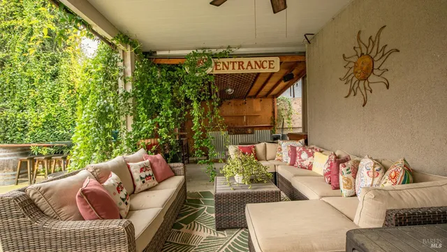 a outdoor living space with furniture and a potted plant