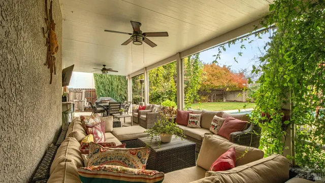 a living room with furniture and a large window