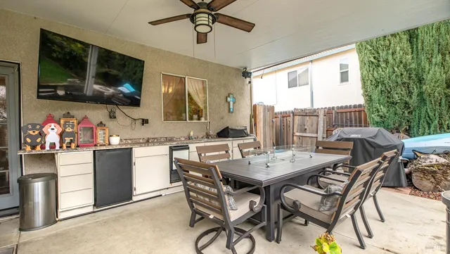 a view of a dining room with furniture window and outside view