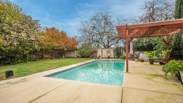 a view of a swimming pool with a patio