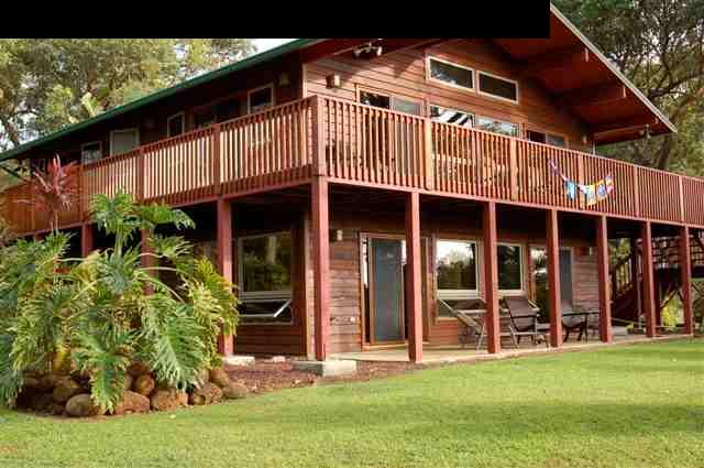 980 East Kuiaha Road Haiku, HI 96708 - Photo 1 of 25 a front view of a house with a garden