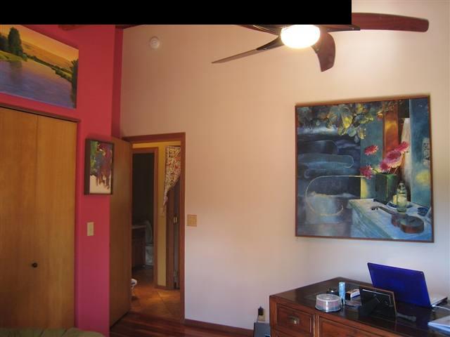 980 East Kuiaha Road Haiku, HI 96708 - Photo 11 of 25 a kitchen with a cabinet and a painting on the wall