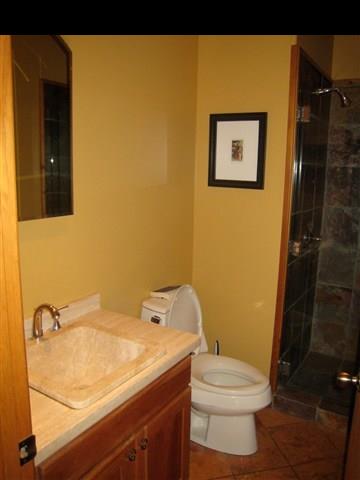 980 East Kuiaha Road Haiku, HI 96708 - Photo 14 of 25 a bathroom with a sink and a toilet