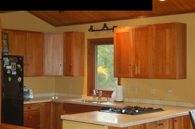 980 East Kuiaha Road Haiku, HI 96708 - Photo 5 of 25 a kitchen with granite countertop a sink stove and cabinets