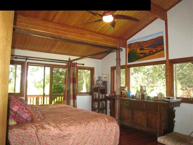980 East Kuiaha Road Haiku, HI 96708 - Photo 10 of 25 a bed sitting in a bedroom next to a window