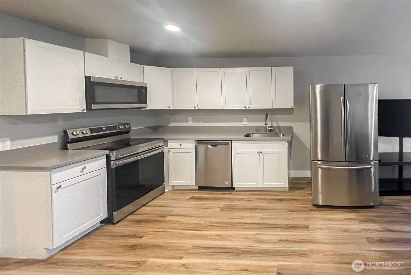 1815 13th Avenue South Seattle, WA 98144 - Photo 11 of 18 a kitchen with a sink stove and refrigerator