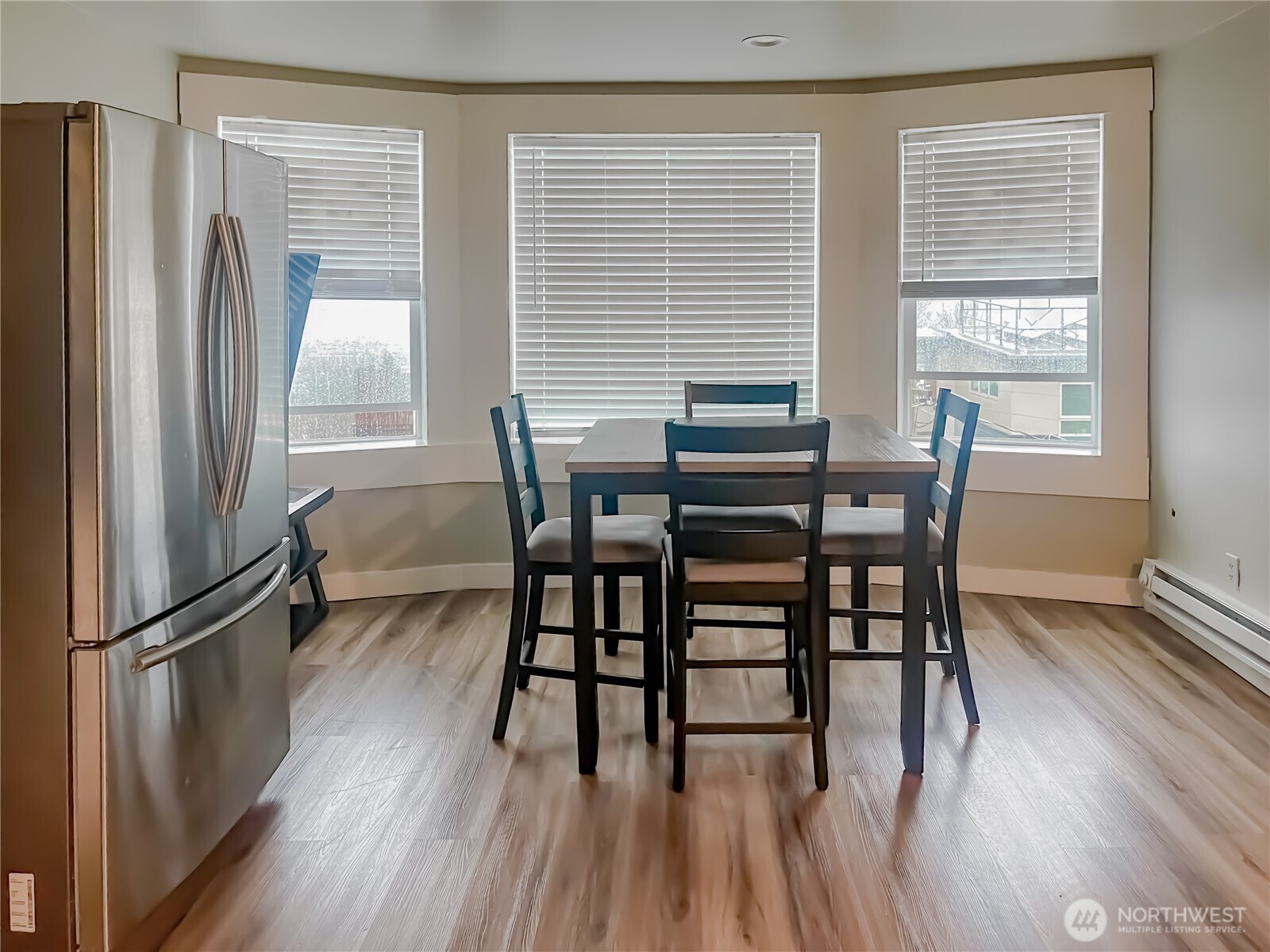1815 13th Avenue South Seattle, WA 98144 - Photo 13 of 18 a view of a dining room with furniture window and outside view