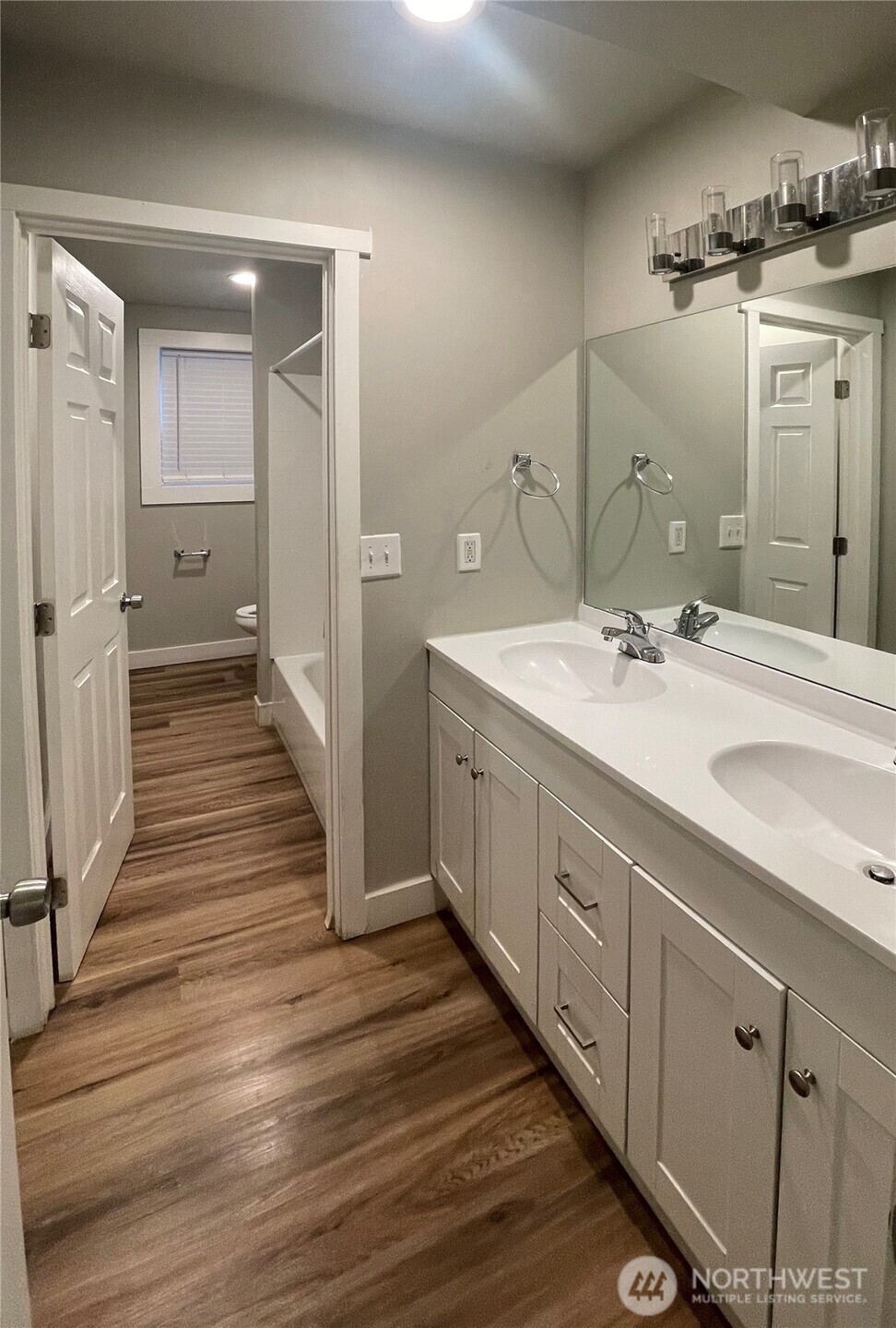 1815 13th Avenue South Seattle, WA 98144 - Photo 17 of 18 a spacious bathroom with a double vanity sink and a mirror