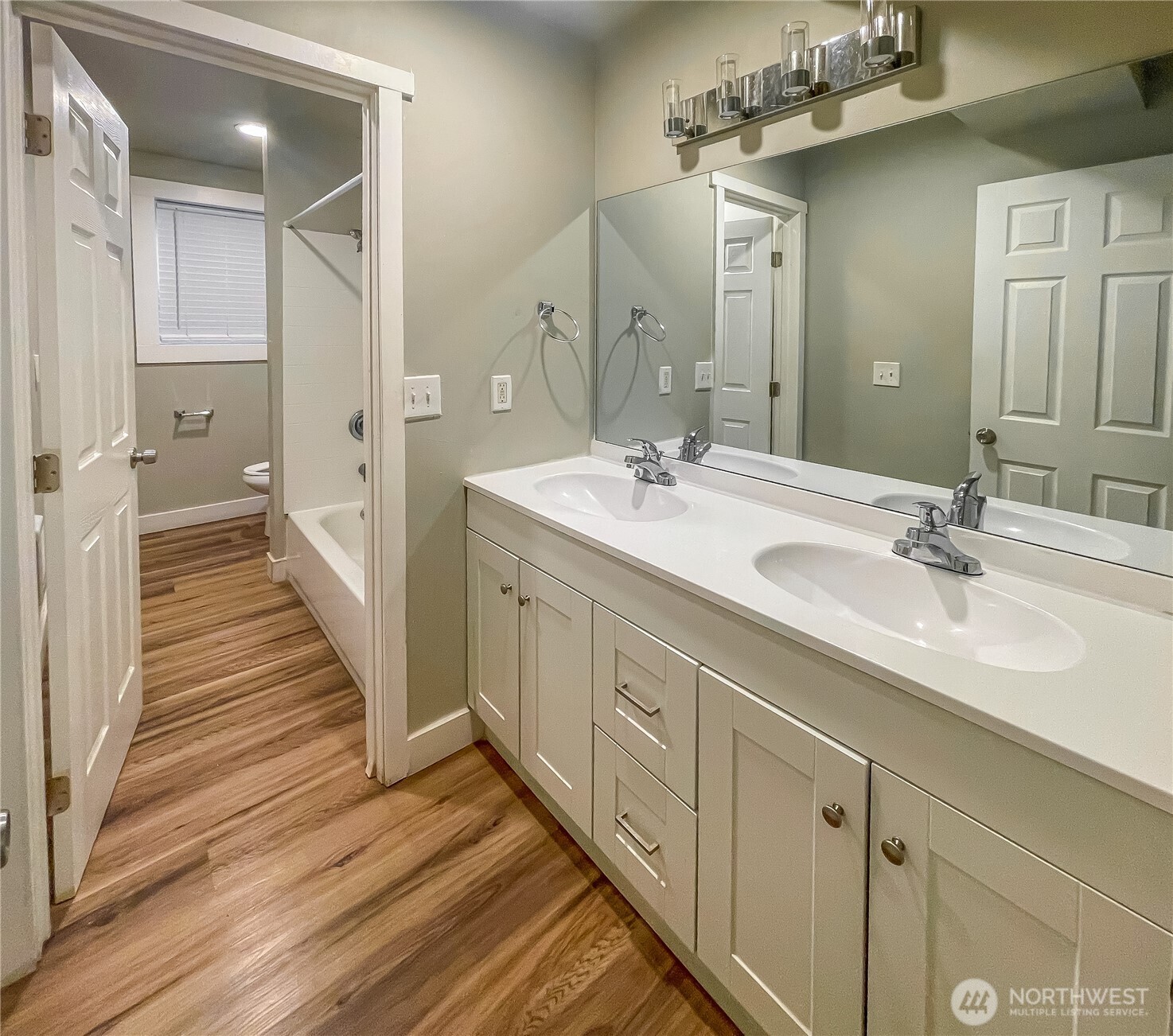1815 13th Avenue South Seattle, WA 98144 - Photo 10 of 18 a spacious bathroom with a double vanity sink and a mirror