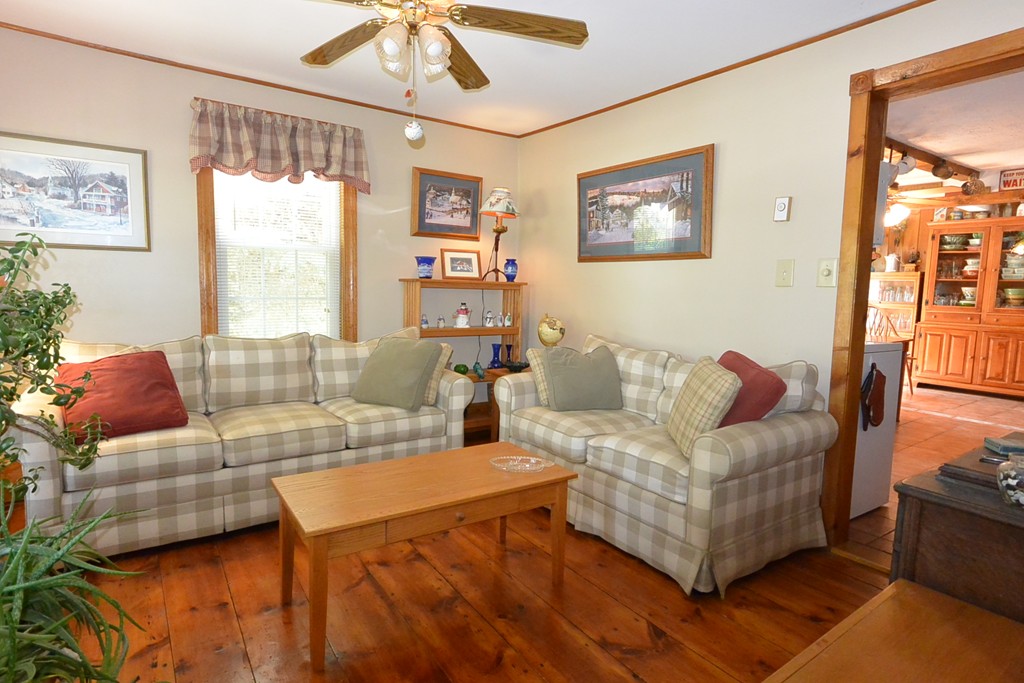 217 Old Common Road Lancaster, MA 01523 - Photo 4 of 22 a living room with furniture and a large window