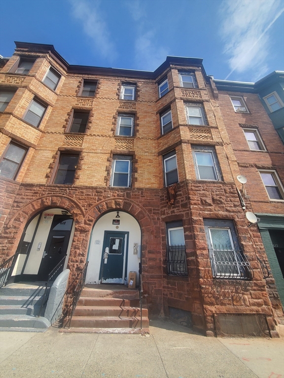620 Dudley Street, Unit 4 Boston, MA 02125 - Photo 13 of 14 a front view of a multi story residential apartment building