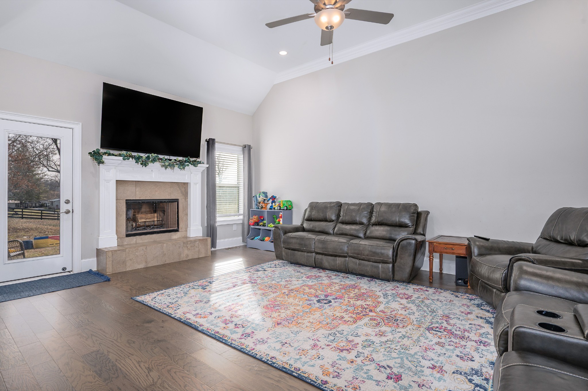 1835 Belotes Ferry Road Lebanon, TN 37087 - Photo 11 of 40 a living room with furniture a flat screen tv and a fireplace
