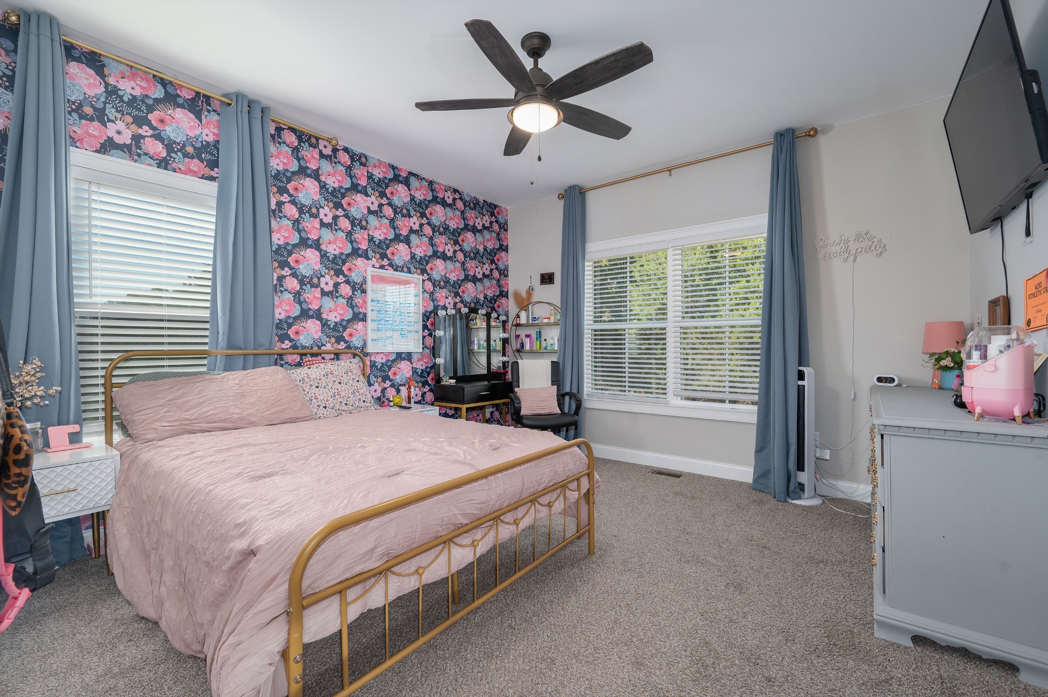 1835 Belotes Ferry Road Lebanon, TN 37087 - Photo 17 of 40 a bedroom with a bed and a flat screen tv