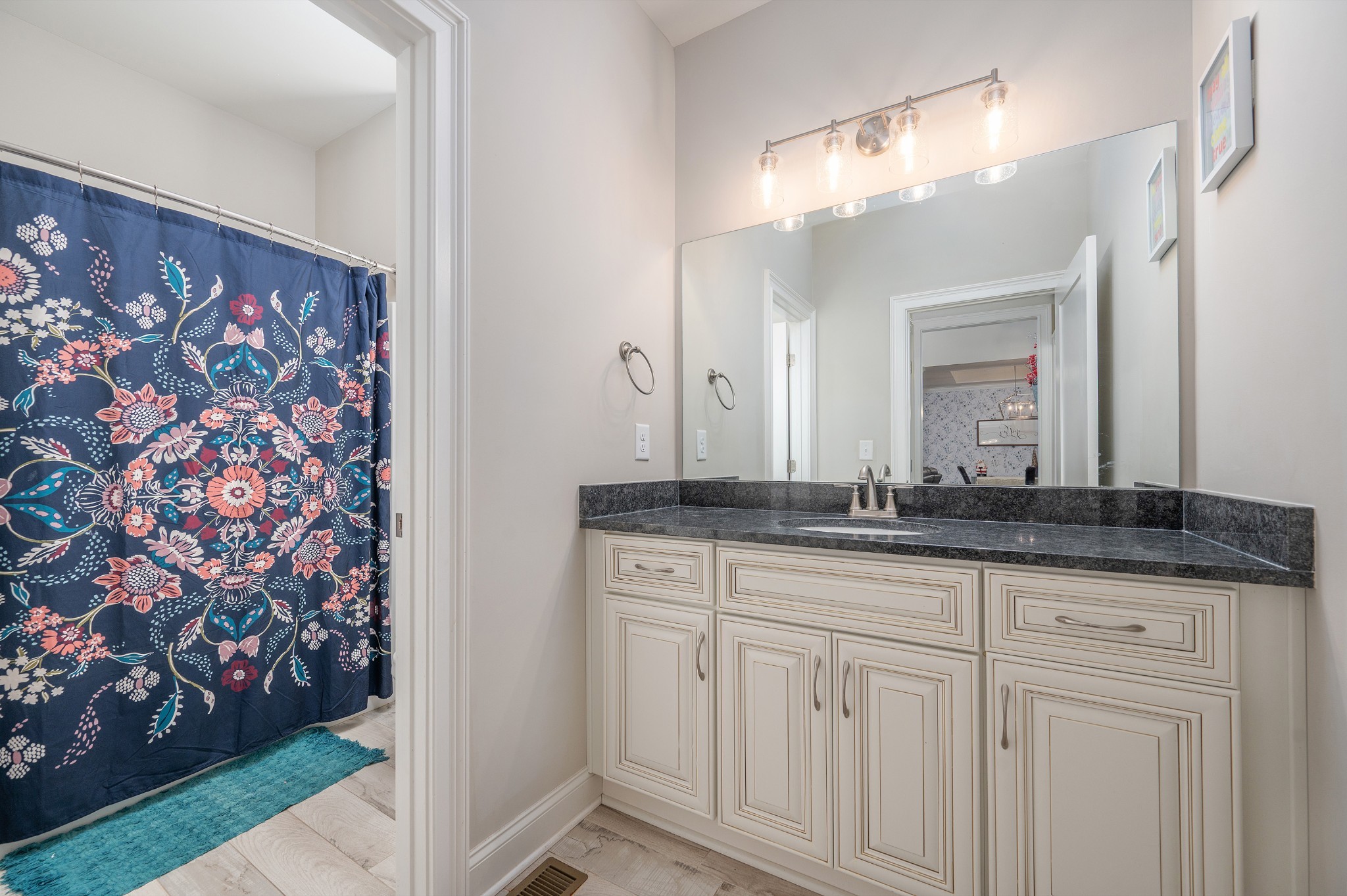 1835 Belotes Ferry Road Lebanon, TN 37087 - Photo 19 of 40 a bathroom with a granite countertop sink and a mirror