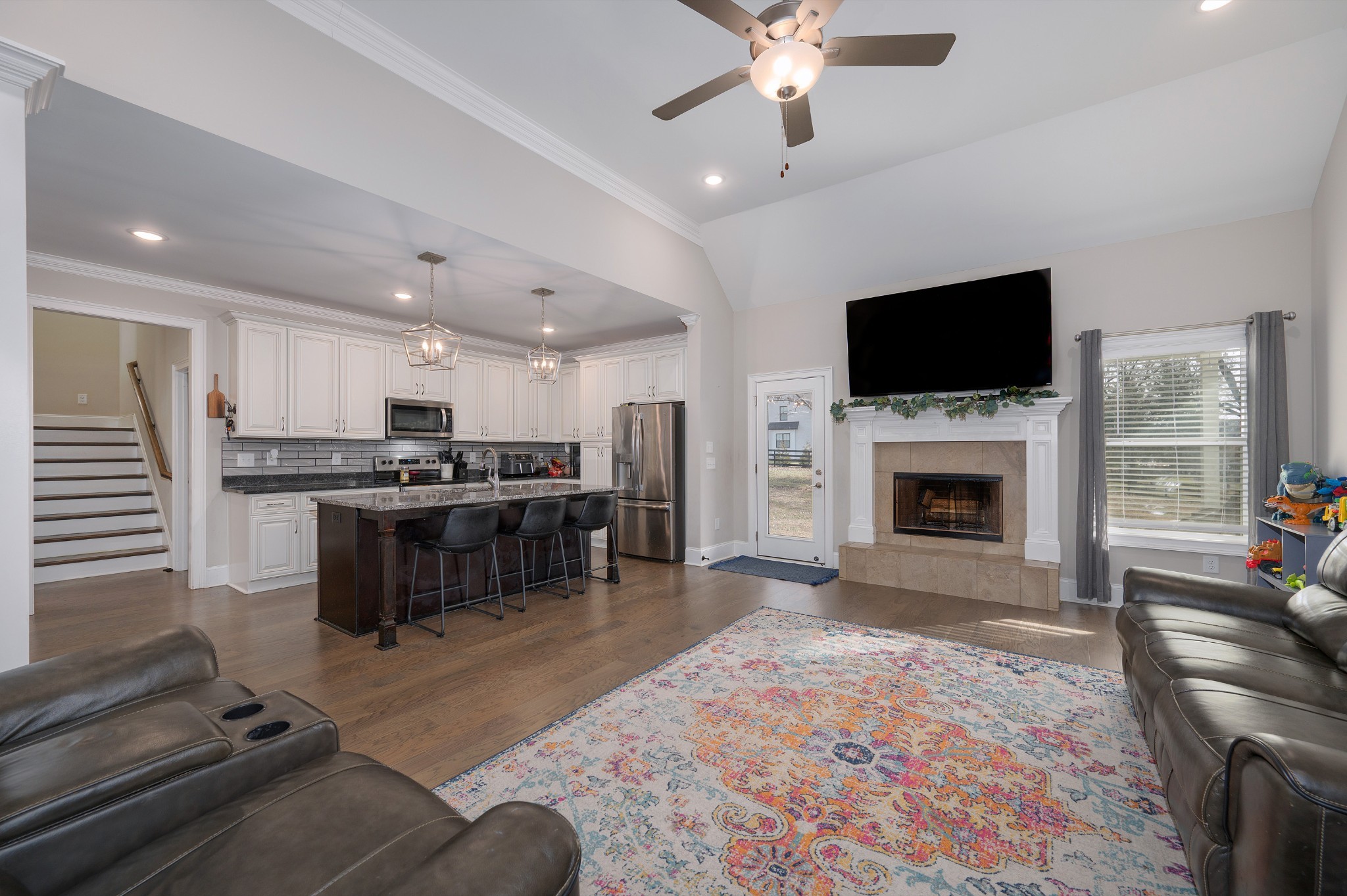 1835 Belotes Ferry Road Lebanon, TN 37087 - Photo 2 of 40 a living room with furniture a fireplace and a flat screen tv