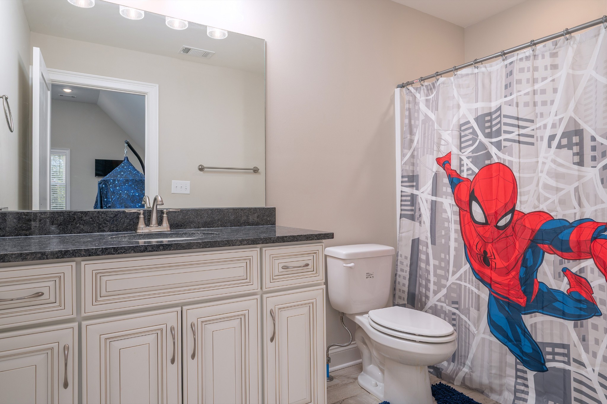 1835 Belotes Ferry Road Lebanon, TN 37087 - Photo 24 of 40 a bathroom with a granite countertop toilet sink and mirror