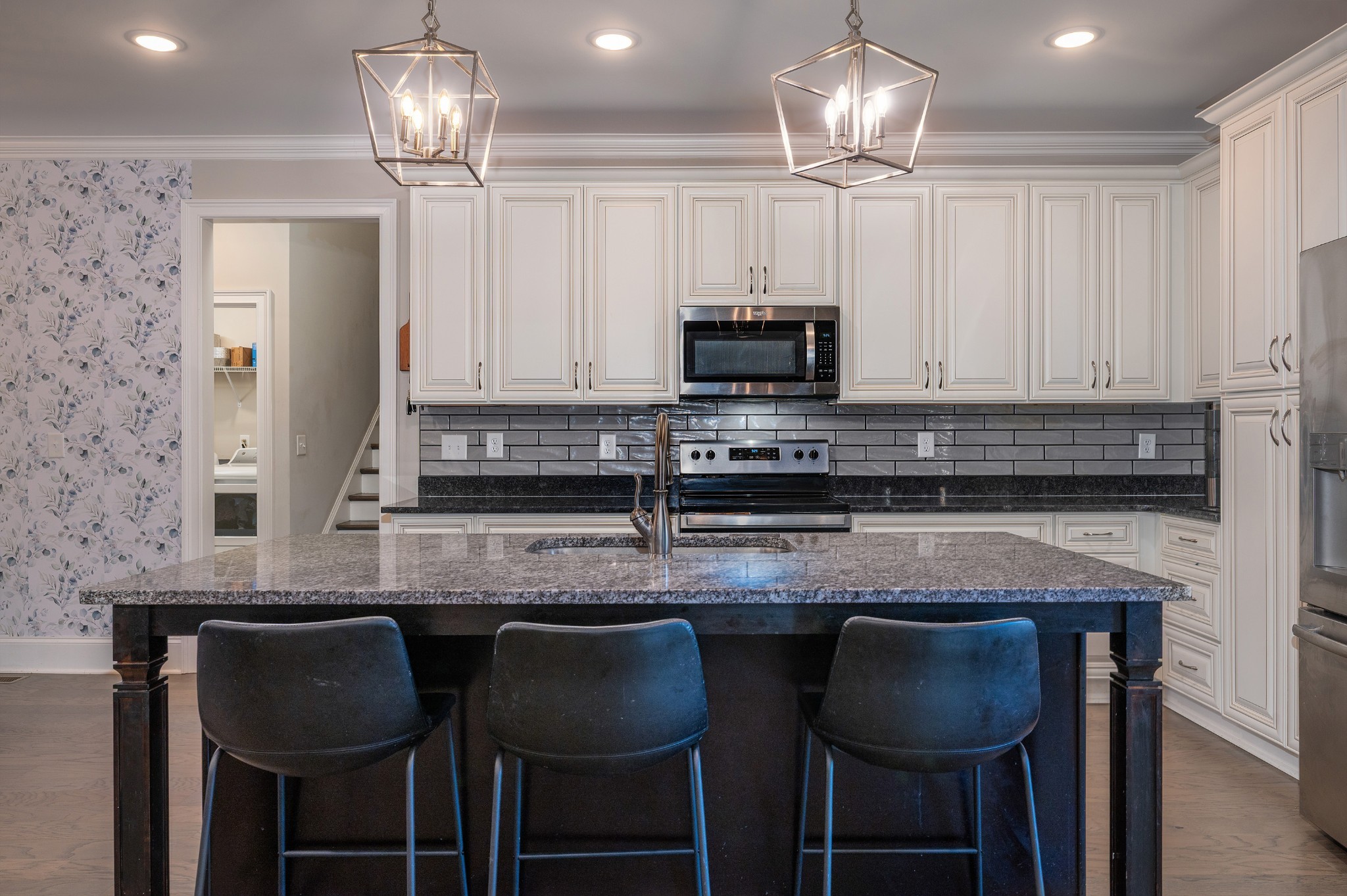 1835 Belotes Ferry Road Lebanon, TN 37087 - Photo 6 of 40 a kitchen with granite countertop a center island and chairs in it