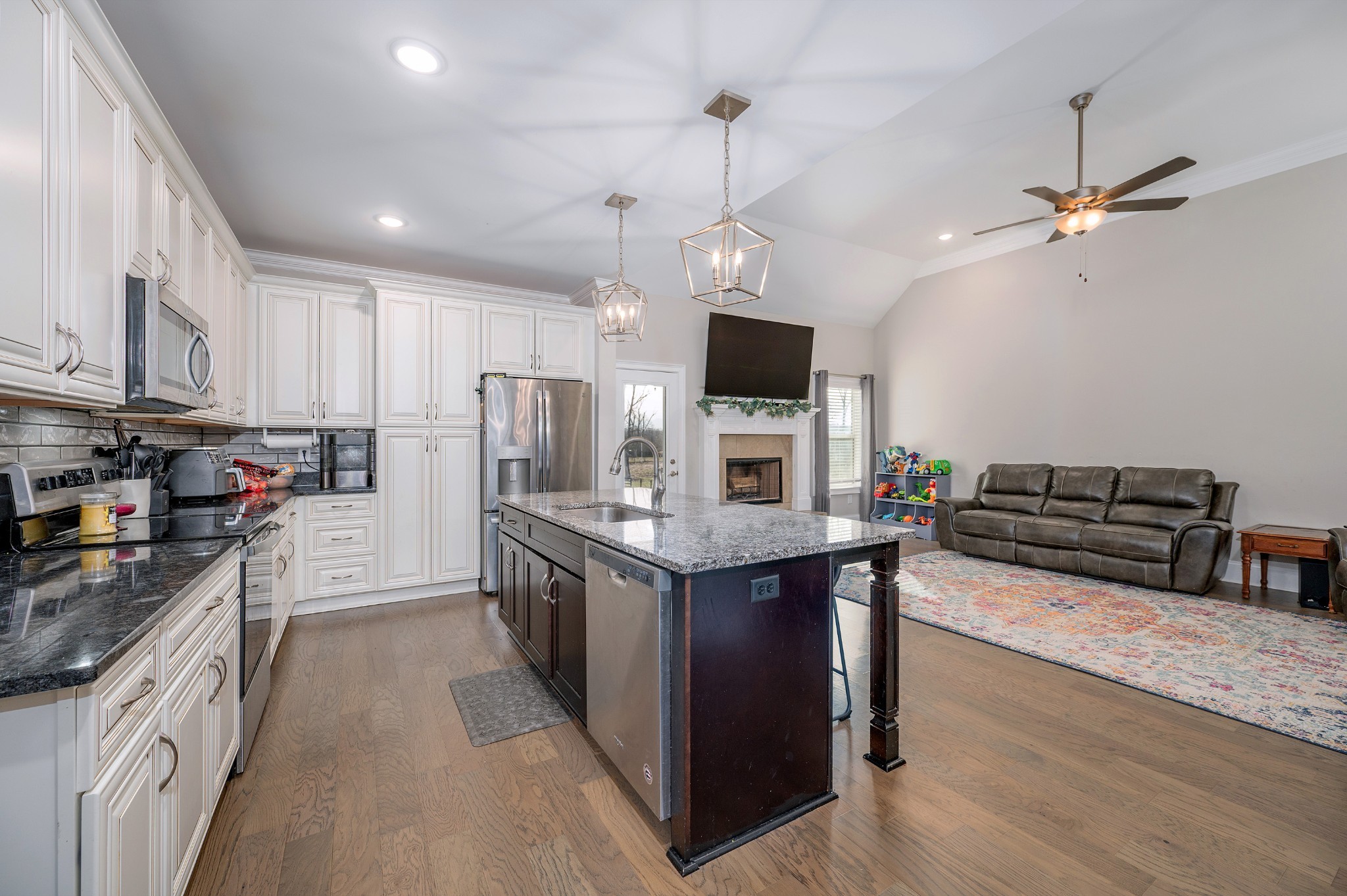 1835 Belotes Ferry Road Lebanon, TN 37087 - Photo 8 of 40 a kitchen with stainless steel appliances granite countertop a stove top oven a refrigerator a sink and dishwasher