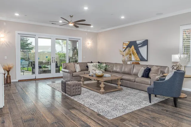a living room with furniture and a large window