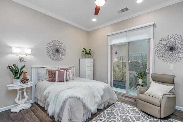 a bedroom with a bed and a television