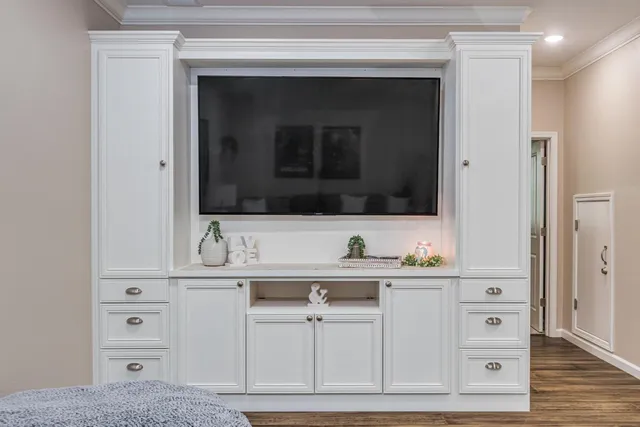 a living room with furniture a rug and a chandelier