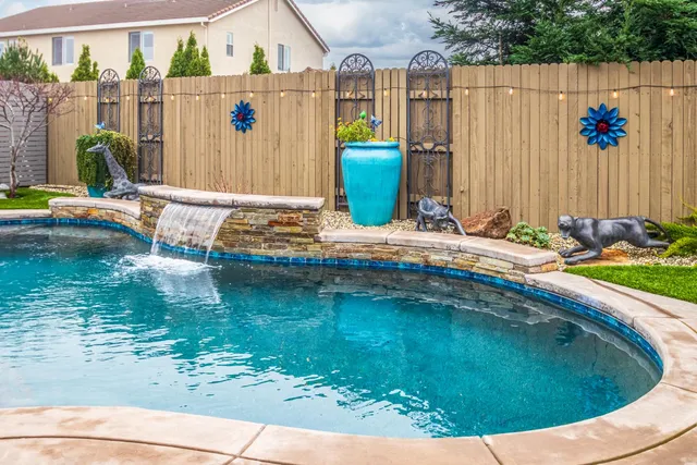 a view of a house with swimming pool and a porch