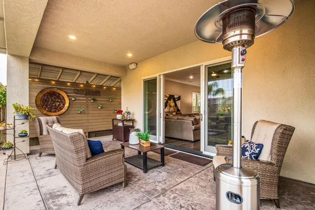 a view of a chairs and table in the patio