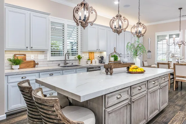 a kitchen with appliances cabinets and a window