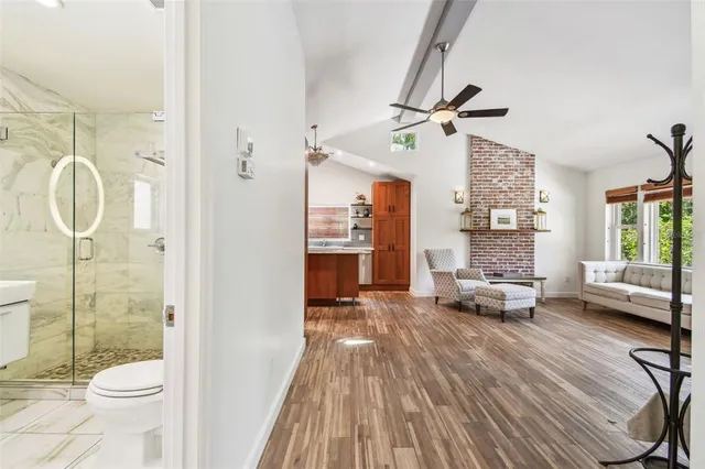 a view of a backyard with table and chairs and potted plants
