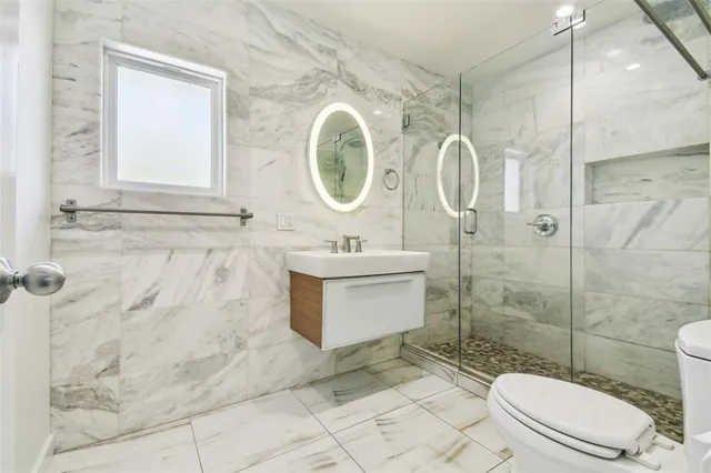 a view of a house with swimming pool and sitting area