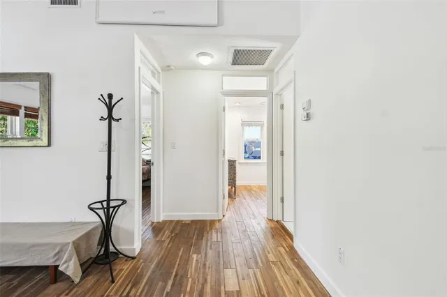 a kitchen with a sink a counter top space and cabinets