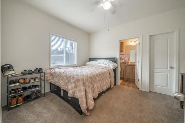 a bed room with a bed and a baby crib