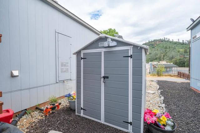 a view of a backyard with a patio