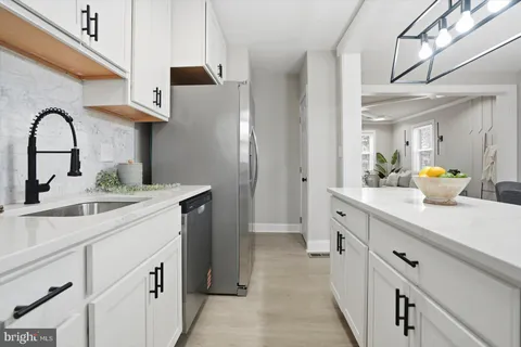 a kitchen with a sink and cabinets