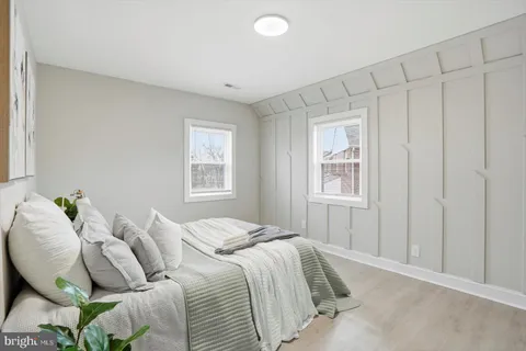 a bedroom with bed and a window