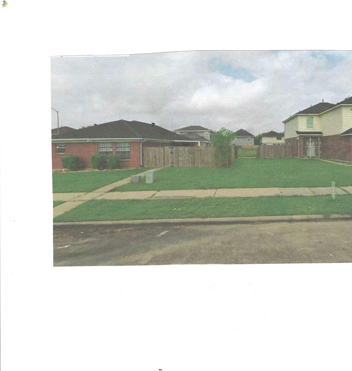 a picture of a yard in front of a house