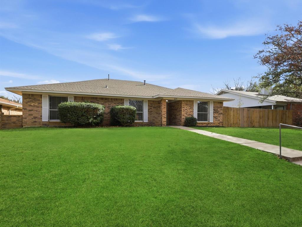 625 Reno Street Lewisville, TX 75077 - Photo 1 of 25 front view of a house with a yard