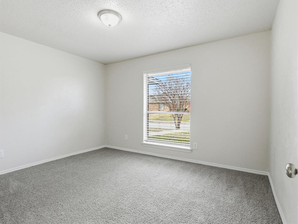 625 Reno Street Lewisville, TX 75077 - Photo 19 of 25 an empty room with a window