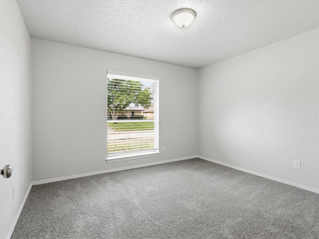 625 Reno Street Lewisville, TX 75077 - Photo 21 of 25 an empty room with a window